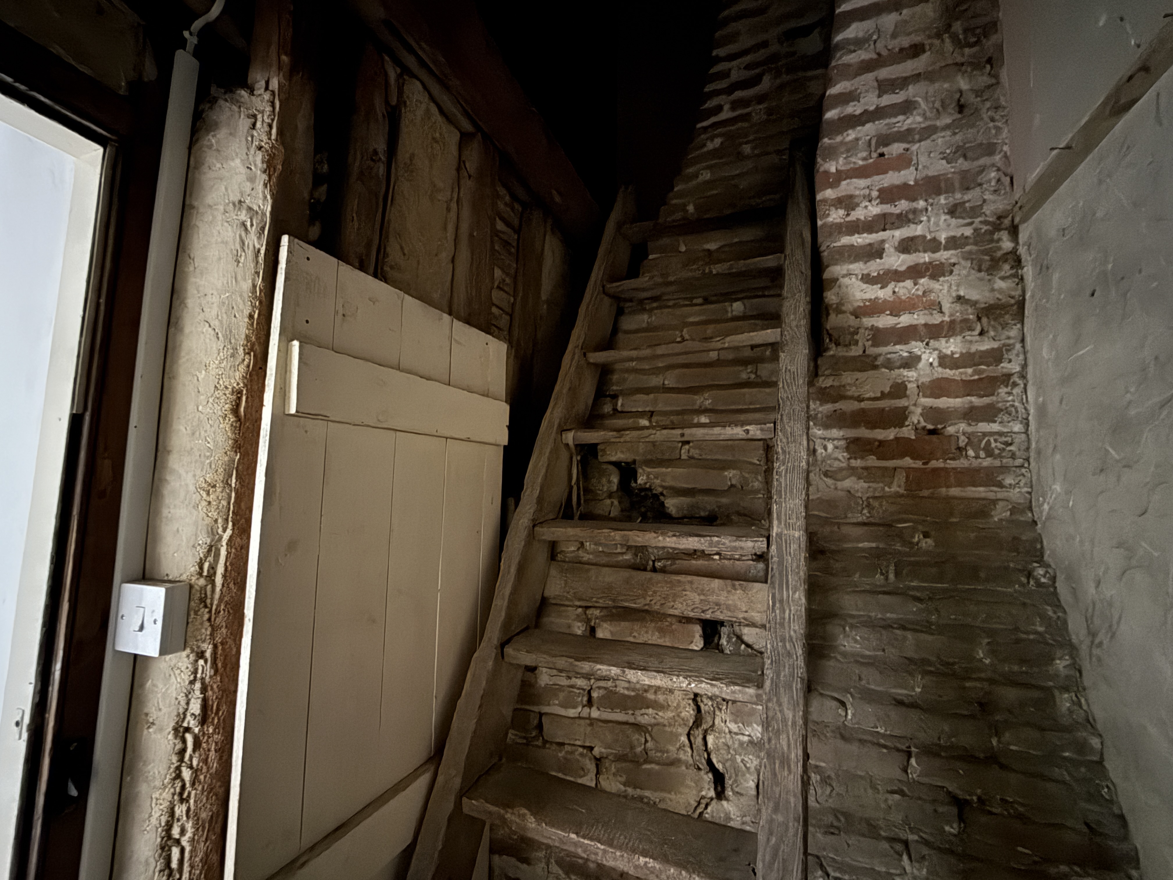 Lot: 59 - HOUSE IN NEED OF IMPROVEMENT IN WEALDEN VILLAGE - Steps leading to open loft in Period Cottage for Improvement